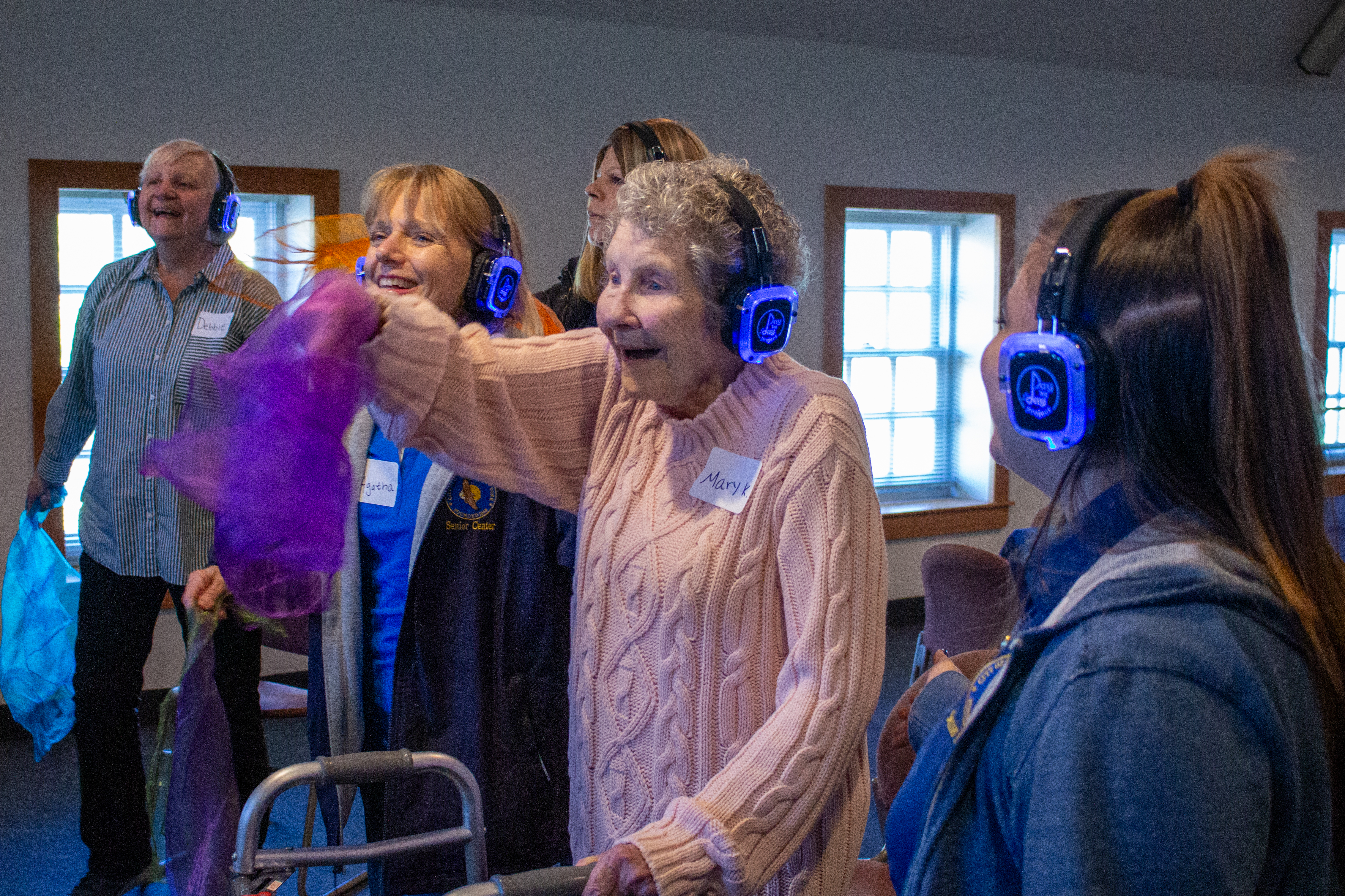 Participants and care partners engaging together during a Memory Disco headphone session